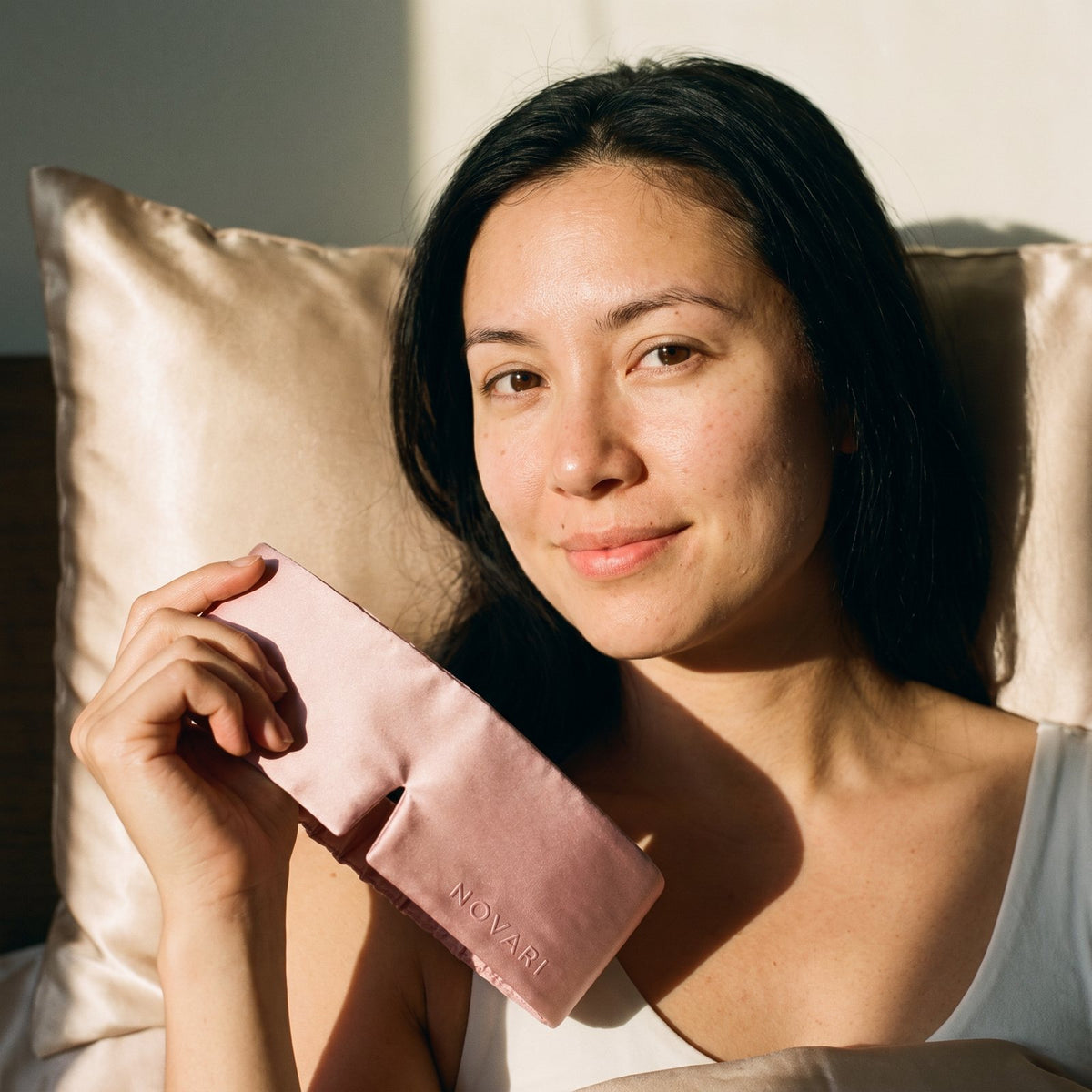 She wakes up rested, holding her pink mask